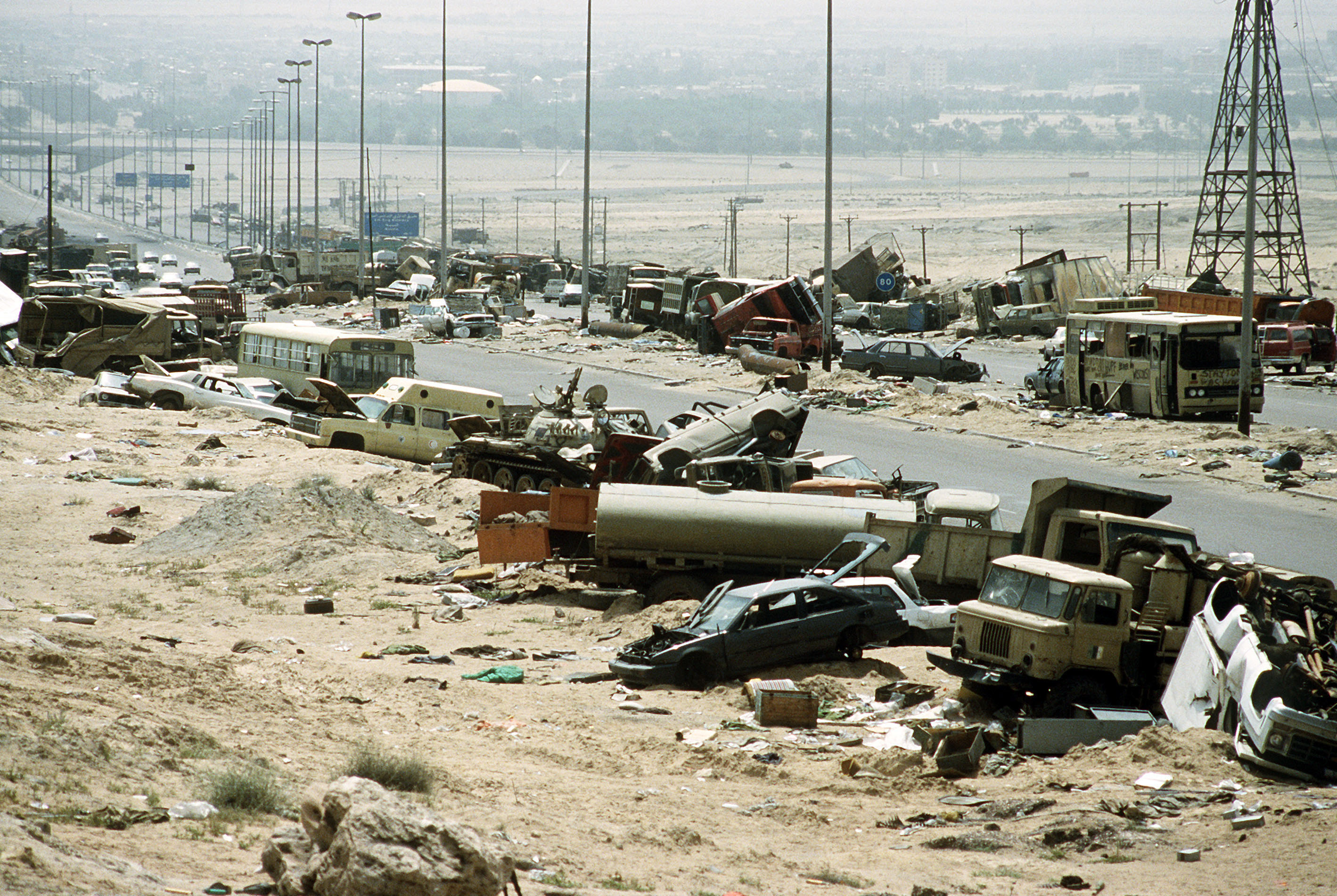 COLEMAN, Tech. Sgt. Joe. Demolished vehicles line Highway 80, also known as the &quot;Highway of Death&quot;, the route fleeing Iraqi forces took as they retreated fom Kuwait during Operation Desert Storm, 18 Abril/April 1991