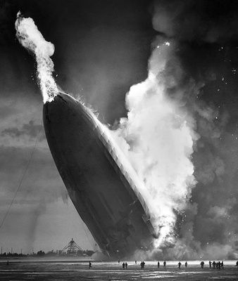 BECKER, Murray. Hindenburg Disaster, the fire bursts out of the nose of the Hindenburg, May 6 1937      